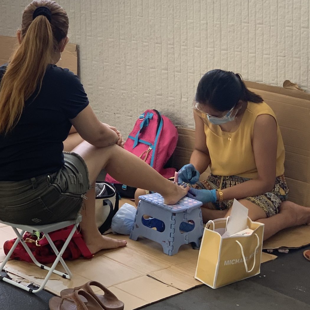 Hong Kong helpers painting nails